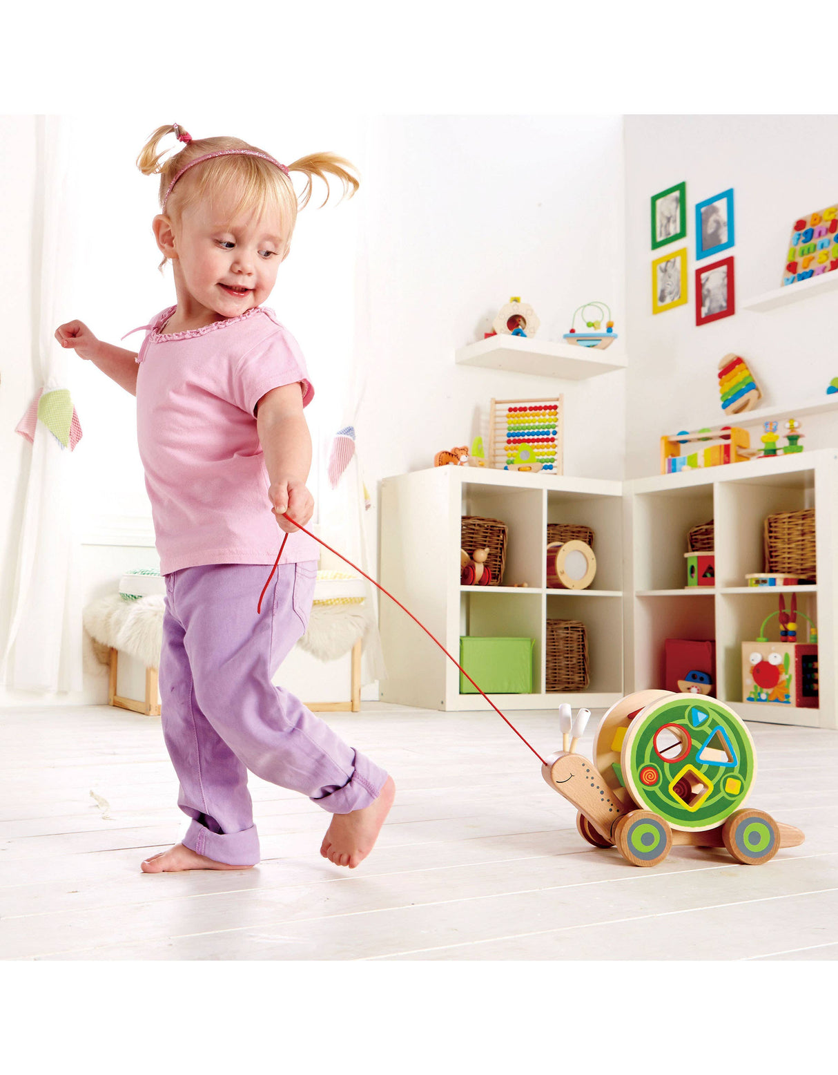 Hape Walk-A-Long Snail - Pull-Along Toy with Shape Sorting.