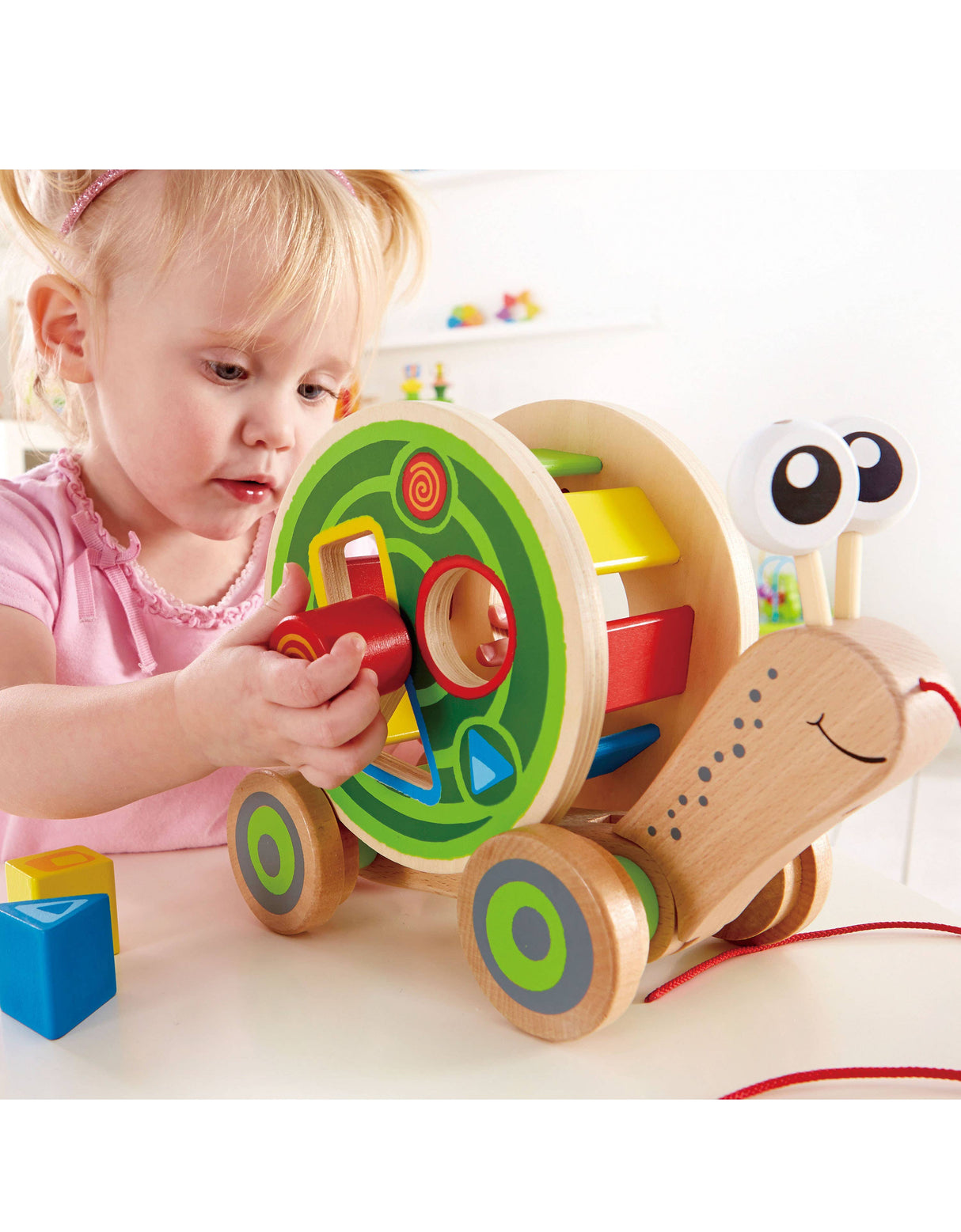 Hape Walk-A-Long Snail - Pull-Along Toy with Shape Sorting.