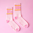 Mid-calf crew socks with subtle ribbed texture and tonal stripe accents, designed for mom’s effortless style with ankle boots or athleisure outfits.