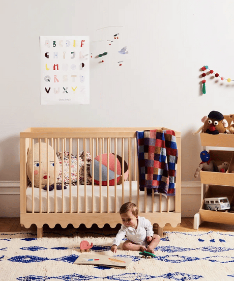 Moss crib with modern design and adjustable mattress support, perfect for babies