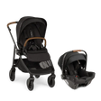 Parent pushing Nuna SWIV stroller with PIPA urbn car seat attached, featuring one-hand 360° seat rotation and lightweight urban-friendly design for seamless travel.