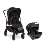 Parent pushing Nuna SWIV stroller with PIPA urbn car seat attached, featuring one-hand 360° seat rotation and lightweight urban-friendly design for seamless travel.