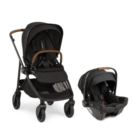 Parent pushing Nuna SWIV stroller with PIPA urbn car seat attached, featuring one-hand 360° seat rotation and lightweight urban-friendly design for seamless travel.