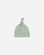 Soft stretchy organic cotton newborn hat with a knotted top in sage green, designed for delicate newborn heads. Machine washable fabric ensures easy care for busy parents.