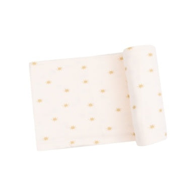 Soft and breathable Simple Suns swaddle blanket with cute sun print, perfect for newborn cuddling