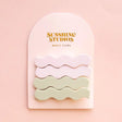 Two wavy hair clips in misty matte finish, designed for effortless half-up hairstyles and securing thick hair without slippage.