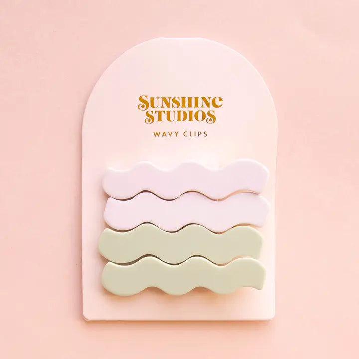 Two wavy hair clips in misty matte finish, designed for effortless half-up hairstyles and securing thick hair without slippage.