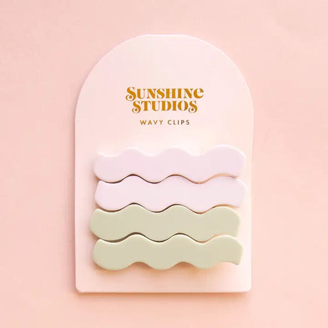 Two wavy hair clips in misty matte finish, designed for effortless half-up hairstyles and securing thick hair without slippage.